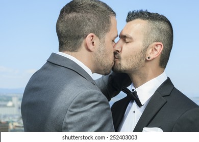 Portrait Of A Loving Gay Male Couple On Their Wedding Day.