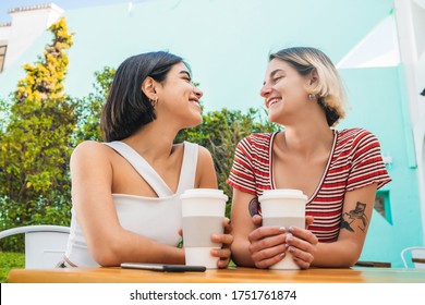 Portrait Of Loving Lesbian Couple Spending Good Time Together And Having A Date At Coffee Shop. LGBT., Love And Relationship Concept.