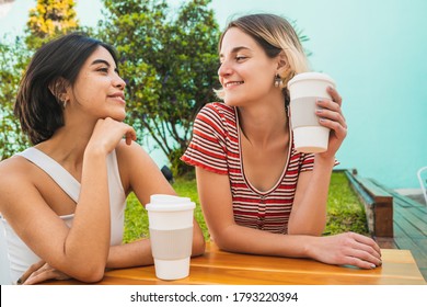 Portrait Of Loving Lesbian Couple Spending Good Time Together And Having A Date At Coffee Shop. LGBT., Love And Relationship Concept.