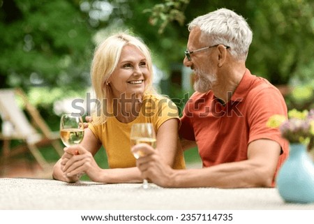 Similar – Image, Stock Photo Senior couple sitting on sofa at home having a relationship problems
