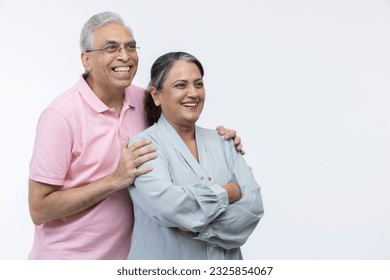 Portrait of loving senior Indian couple, standing on white background. - Shutterstock ID 2325854067