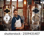 Portrait, machine and man brewer in distillery for quality control, manufacturing or production. Industry, job and male entrepreneur with equipment for beer fermentation for oktoberfest in Munich.