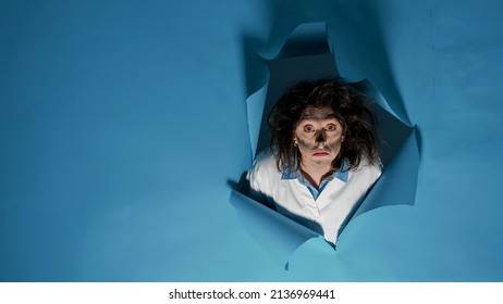 Portrait Of Mad Crazy Chemist With Messy Hair After Scientific Explosion, Making Goofy Facial Expressions In Studio. Silly Foolish Scientist Having Funny Explosive Hairstyle, Fun Woman.