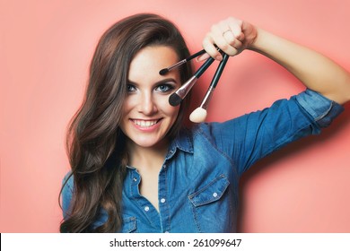 Portrait Of Make Up Artist Woman With Makeup Brushes Near Face. Beauty Concept