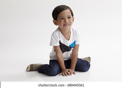 Portrait Of Malay Boy About 3 To 6 Years Old Sitting