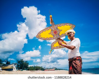 Portrait Of The Malaysia Kite Maker Over The Blue Sky