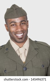 Portrait Of A Male African American US Soldier Smiling Over Gray Background