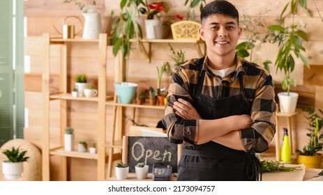 Portrait Of Male Asian Florist In Shop