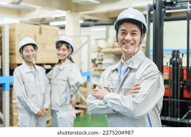 portrait of male asian worker in a warehouse - Powered by Shutterstock