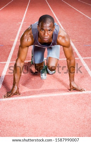 Similar – Black man practicing yoga in urban background.