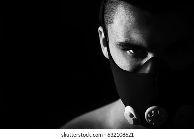 Portrait Of Male Athlete Wearing Training Mask