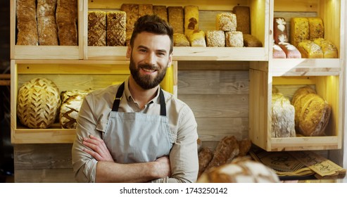 Portrait Of Male Baker Working In Bakery Shop