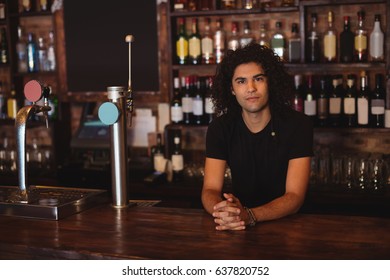 Portrait Of Male Bar Tender At Bar Counter