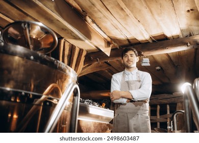 Portrait of male brewer standing by tank in brewery. Man examining the beer in processing section. - Powered by Shutterstock