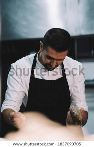 Similar – Image, Stock Photo African man works in pastry shop.