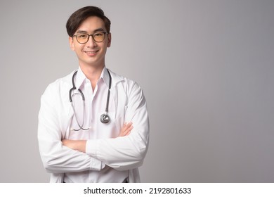 Portrait of male confident doctor over white background studio, healthcare and Medical technology concept. - Powered by Shutterstock