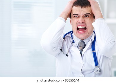 Portrait Of Male Doctor Having Bad News