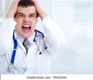 Portrait Of Male Doctor Having Bad News