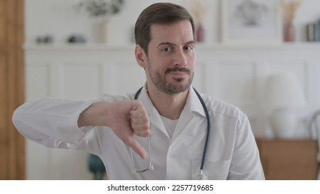 Portrait of Male Doctor showing Thumbs Down Gesture - Shutterstock ID 2257719685