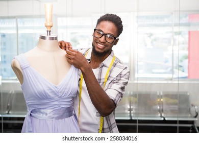 Portrait Of Male Fashion Designer And Mannequin