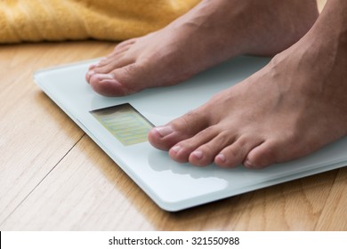 Portrait Of Male Feet On A Scale