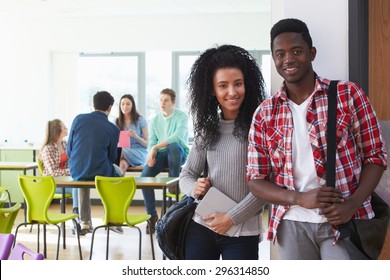 Portrait Of Male And Female College Students In Classroom