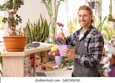 Portrait of male florist working in shop
