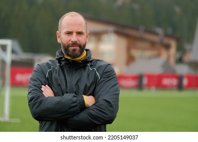 Portrait of a male football coach at the stadium field.  - Powered by Shutterstock