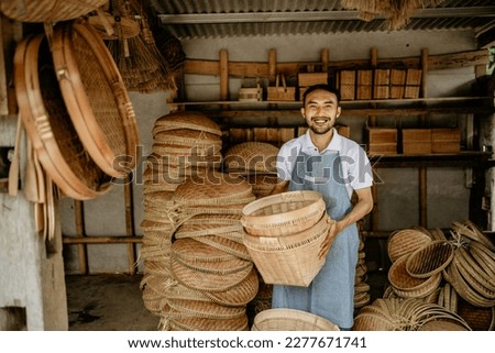 portrait of male handicraft artist working at his shop