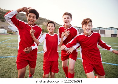 Portrait Of Male High School Soccer Team Celebrating