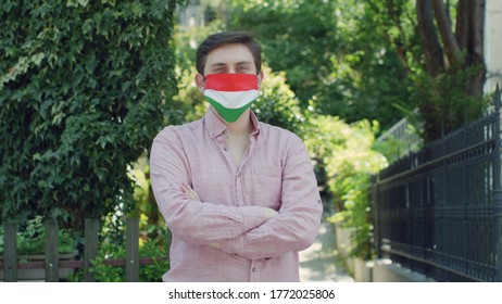 Portrait Of Male With Medical Mask With Hungary Flag. 