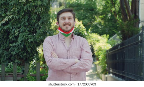 Portrait Of Male With Medical Mask With Hungary Flag. Smiling.