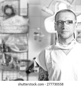 Portrait of  male nurse ICU  with tattoo and dreadlocks on emergency room