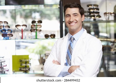 Portrait Of Male Optician By Glasses Display