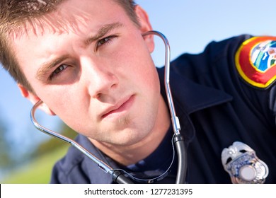 Portrait Of Male Paramedic With Stethoscope Outdoors