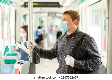 Portrait Of Male Passenger In Personal Protective Equipment Traveling In Public Transport