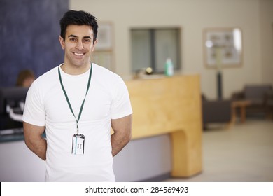 Portrait Of Male Physiotherapist In Hospital Reception