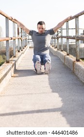 Portrait Of Male Runner Streching