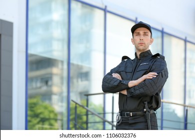 Portrait Of Male Security Guard In Uniform Outdoors