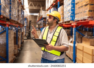 Portrait of male staff with holding clipboard working in warehouse, Industrial and industrial workers concept. - Powered by Shutterstock