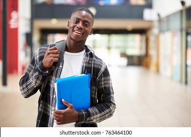 Portrait Of Male Student Standing In College Building