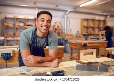 Portrait Of Male Student Studying For Carpentry Apprenticeship At College