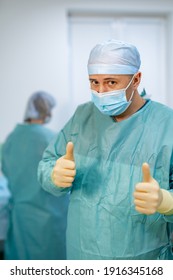 Portrait Of Male Surgeon Wearing Surgical Mask In Operation Theater At Hospital