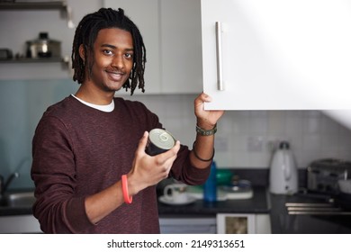 Portrait Of Male University Or College Student Cooking Meal In Campus Kitchen