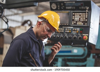 Portrait of male worker talking on radio phone calling team worker. machine technology invention industry manufacturing factory - Powered by Shutterstock