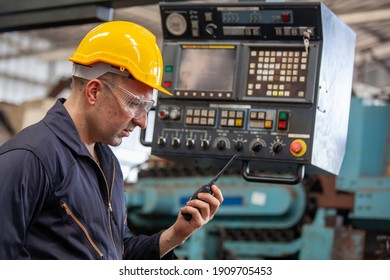 Portrait Of Male Worker Talking On Radio Phone Calling Team Worker. Machine Technology Invention Industry Manufacturing Factory