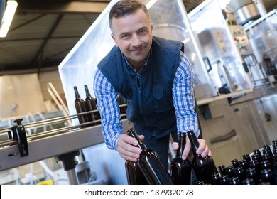 Portrait Of Male Worker In Wine Bottling Plant