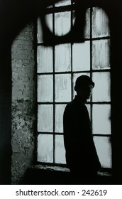 Portrait Of Man In Abandonded Warehouse.