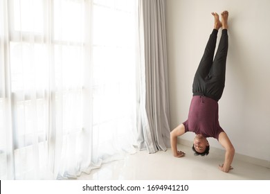 Portrait Of Man Asian Workout From Home Hand Stand Push Up