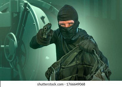 Portrait Of Man In Balaclava Mask Holding Gun In Front Of Security Metal Vault Door In Bank Or Casino Heist Concept In Heist Hollywood Movie Style